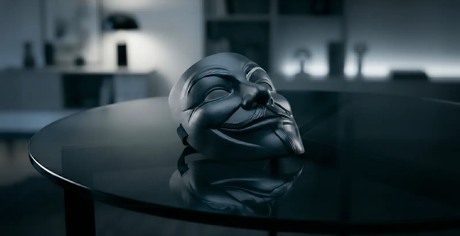 black Anonymous mask reflecting on a glass table, symbolizing Android privilege escalation vulnerabilities and zero-permission deputy attacks in cybersecurity research.